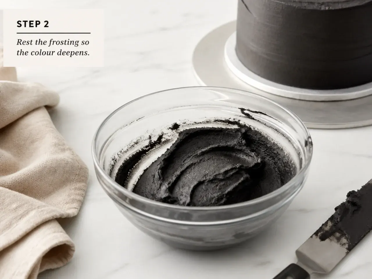 black cake decoration — step 2: rest the frosting so the colour deepens