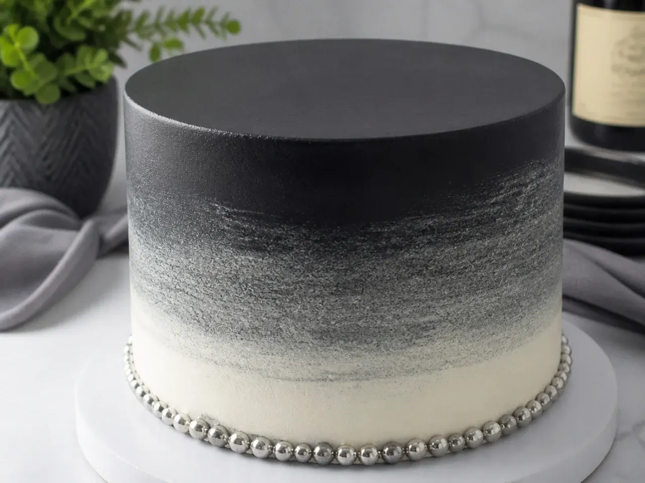 Elegant black to white ombre black cake for men with silver dragee border