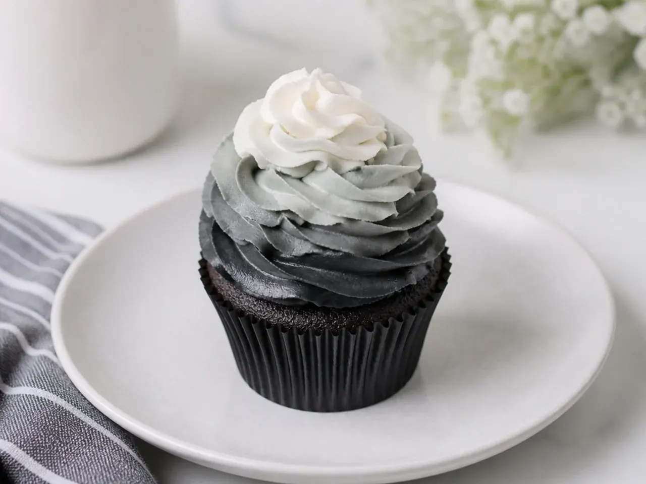 Modern ombre cupcakes fading from black to gray buttercream