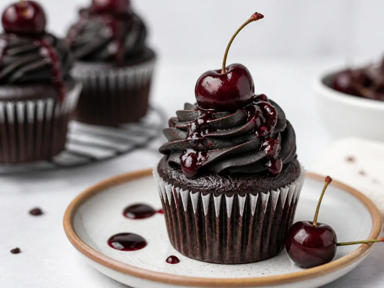Vintage black cherry cordial cupcakes with whole cherry on top