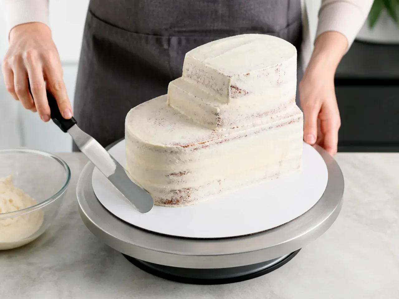 buttercream dinosaur cake — step 3: stack and crumb-coat the cake