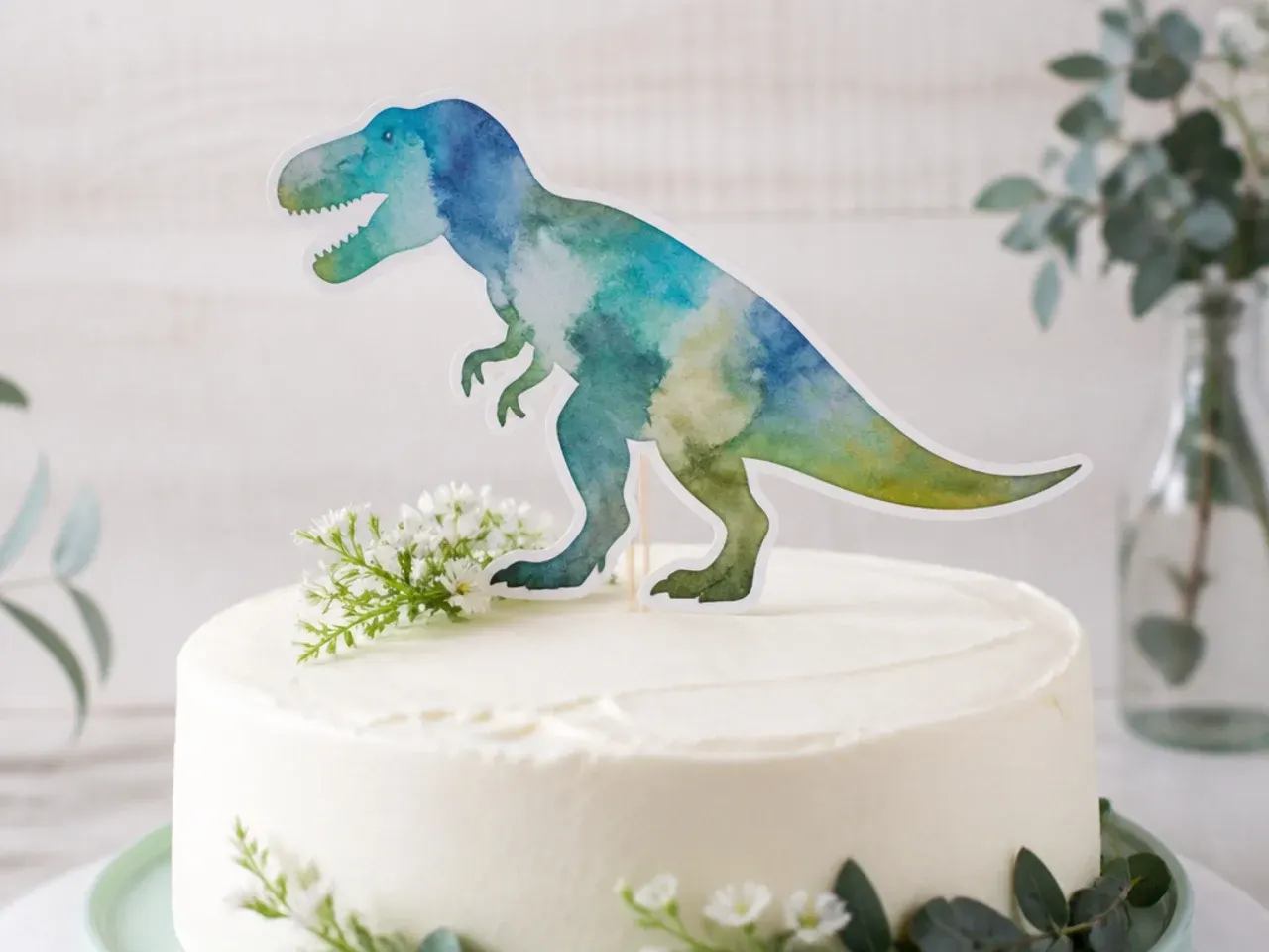 Elegant watercolor dinosaur silhouette painted on buttercream cake topper
