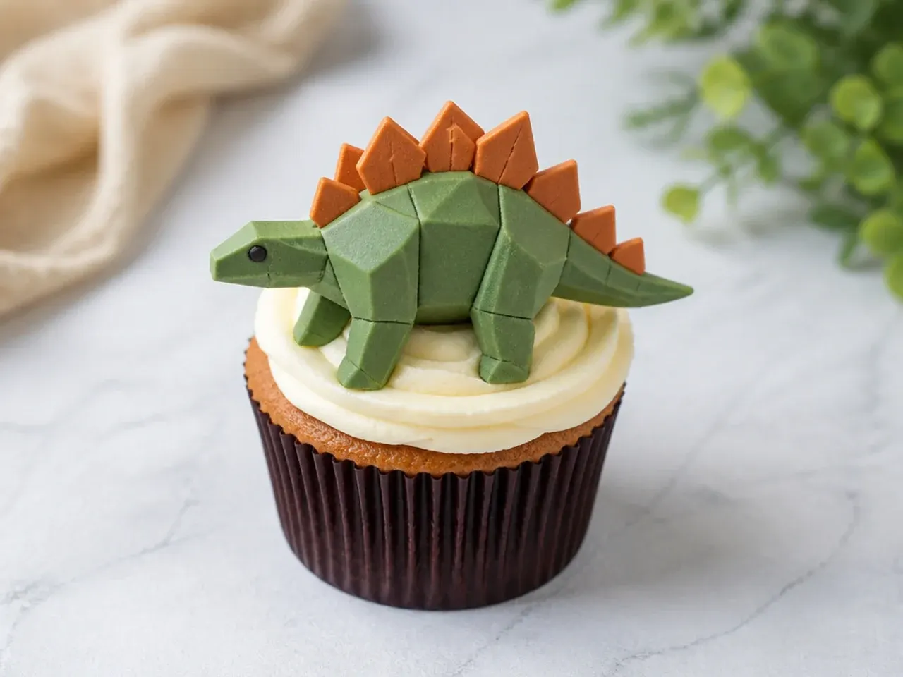 Modern geometric dinosaur cupcakes with low-poly fondant facets