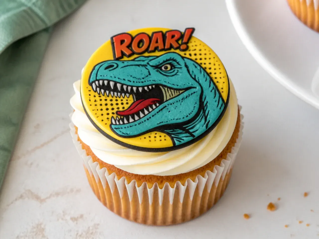 Vintage retro comic dinosaur cupcakes with bold outlined fondant tops