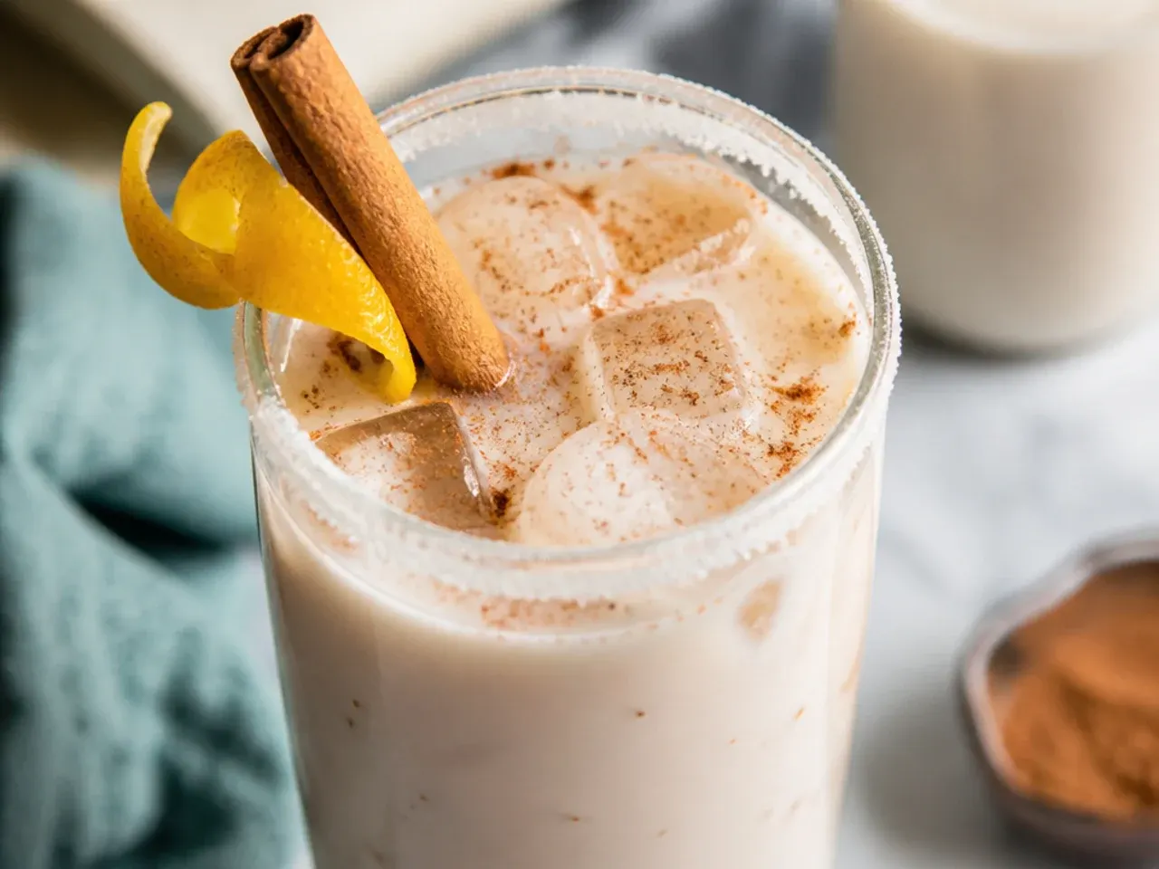 Creamy horchata in a glass with cinnamon dusting