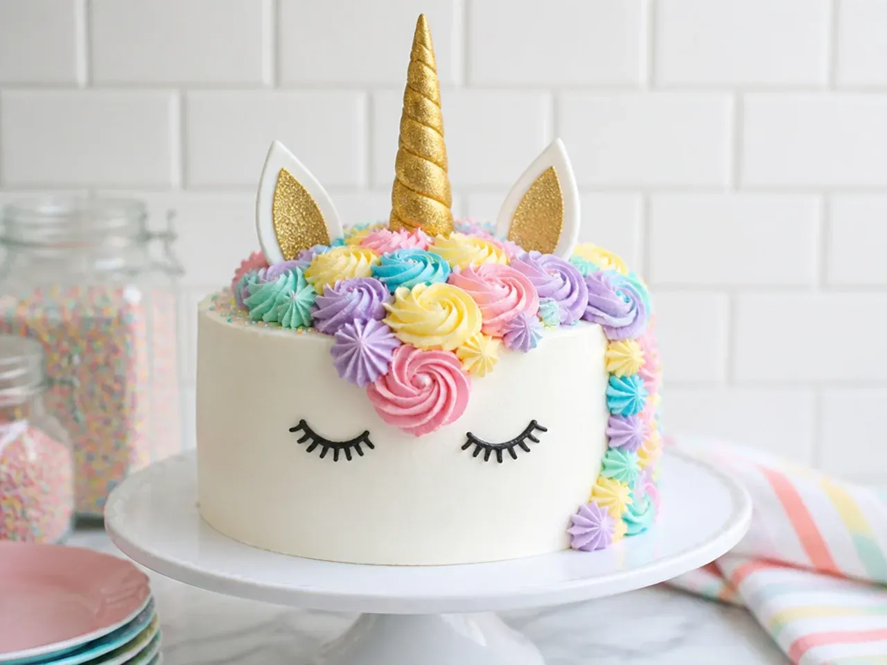 No-bake easy unicorn cake decorated from a store-bought white cake with piped pastel mane