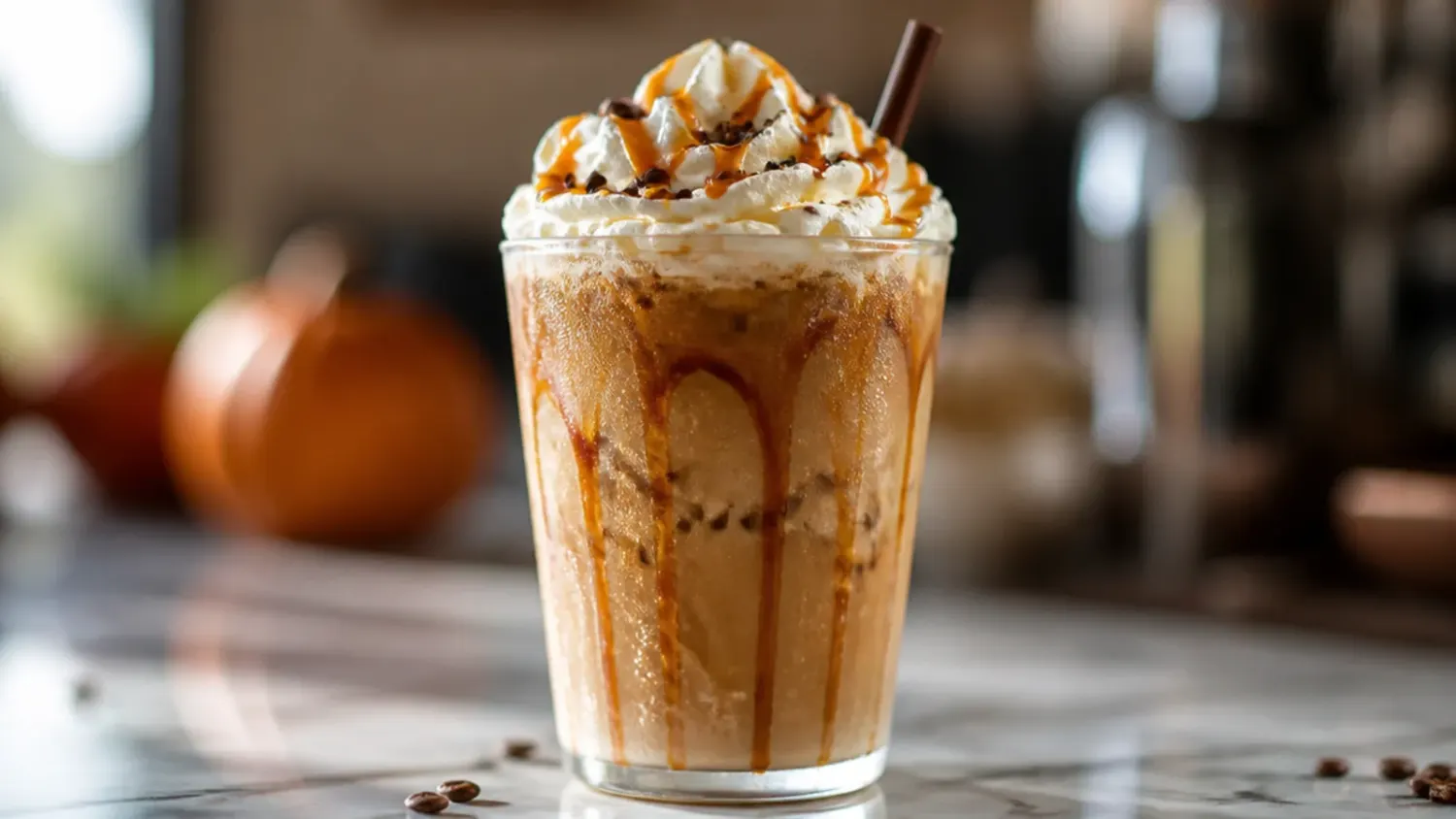 A row of cozy fall Starbucks-inspired drinks, including a pumpkin spice latte with whipped cream and an iced apple crisp macchiato, on a wooden table with autumn leaves