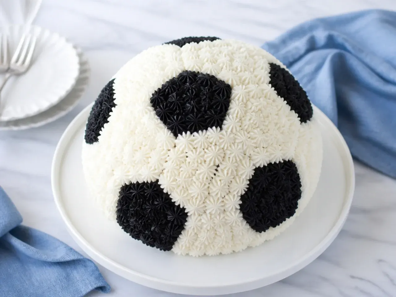 Delicate piped rosette soccer-ball football cake design