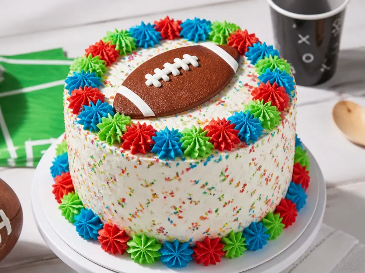 Colourful confetti football party cake for boys with sprinkles and buttercream stars
