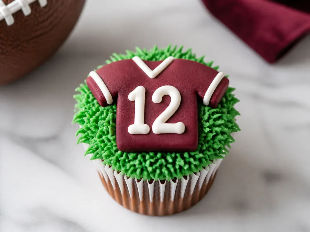 Charming football cupcakes piped with bold jersey numbers in contrasting buttercream