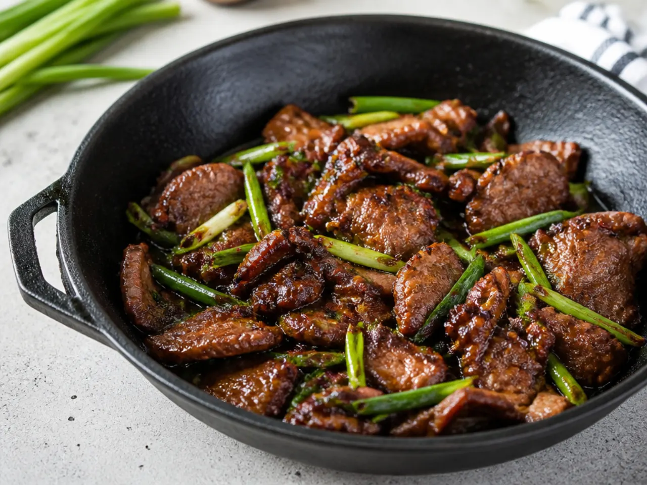 Rustic cast-iron charred Mongolian beef with crispy seared edges