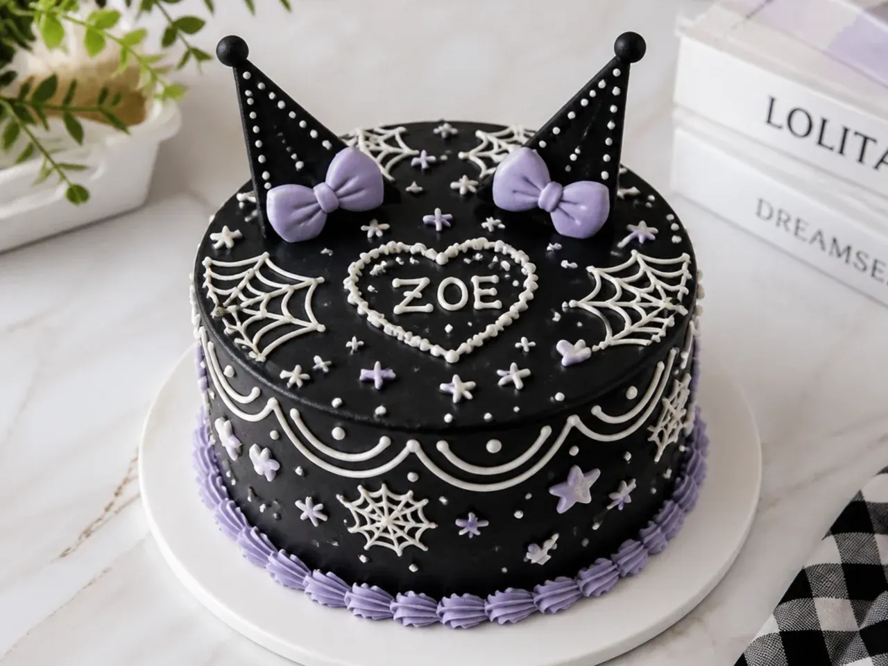 Creative black chalkboard-effect Kuromi cake design with white piped doodles