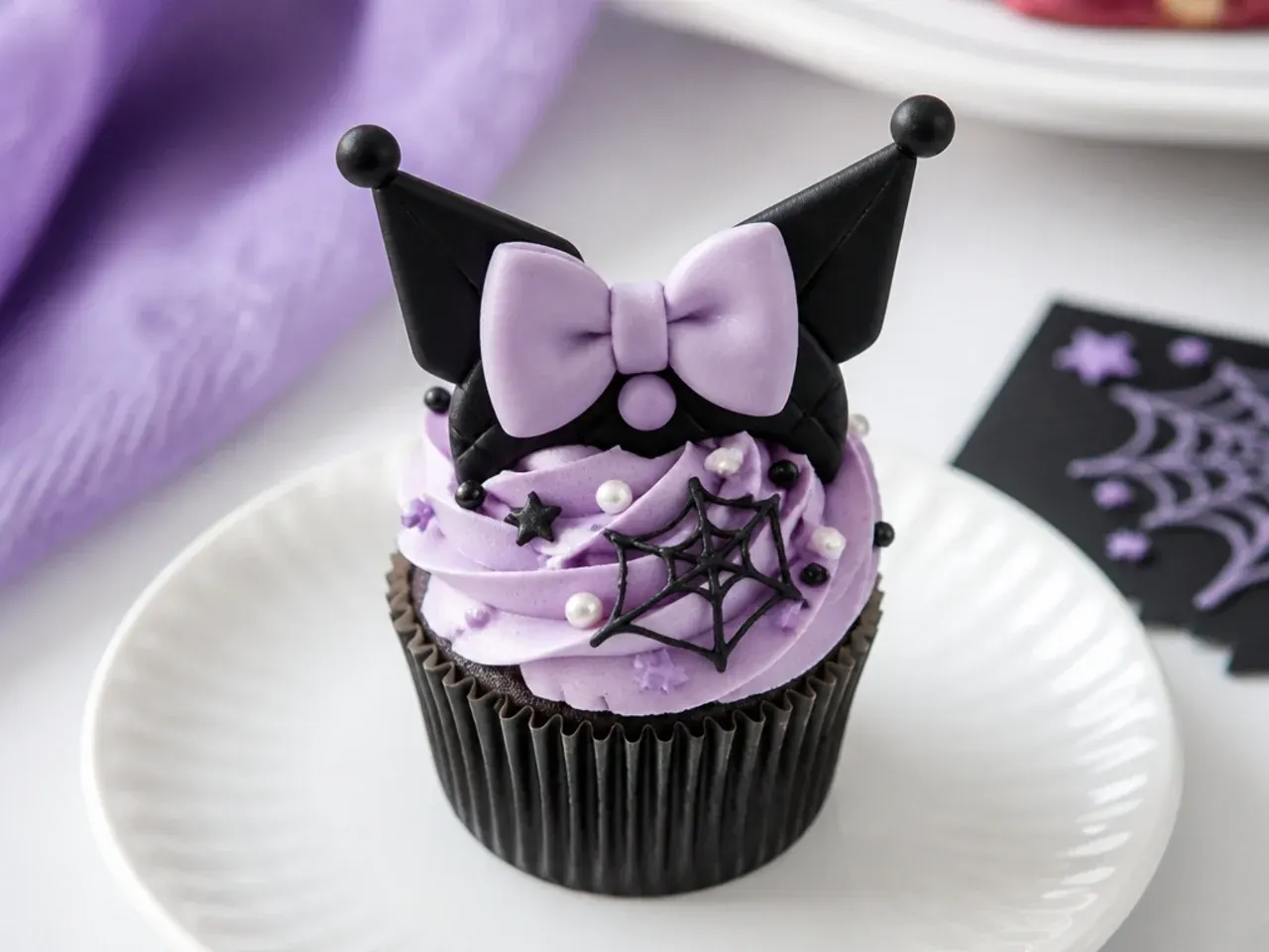 Elegant fondant bow and pearl Kuromi cupcake toppers with lilac swirls