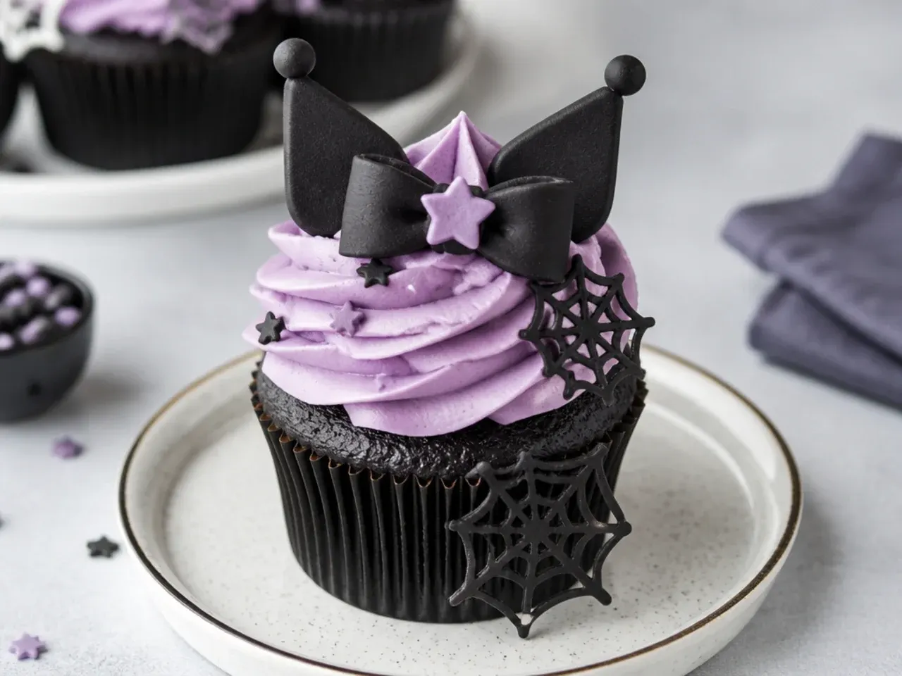 Bold Kuromi cupcakes with dark black-cocoa cake and bright lavender frosting