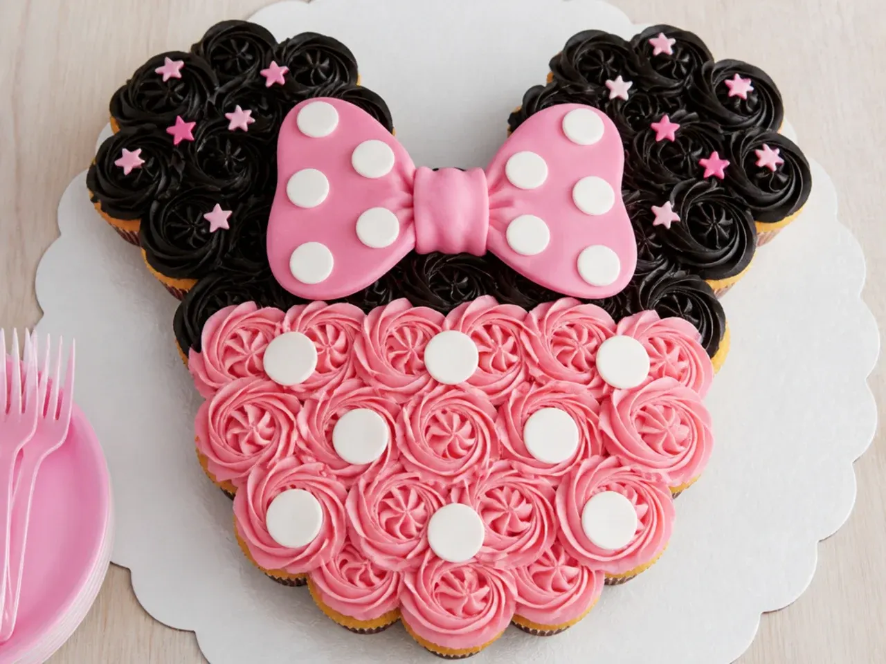 Minnie Mouse birthday cake made from pull-apart cupcakes arranged in an ears shape