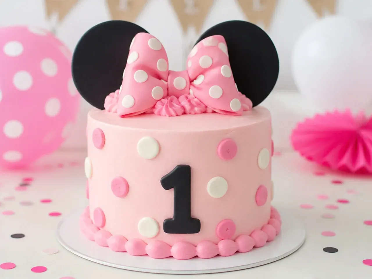 Charming first birthday smash cake Minnie Mouse cake idea with soft piped dots and bow