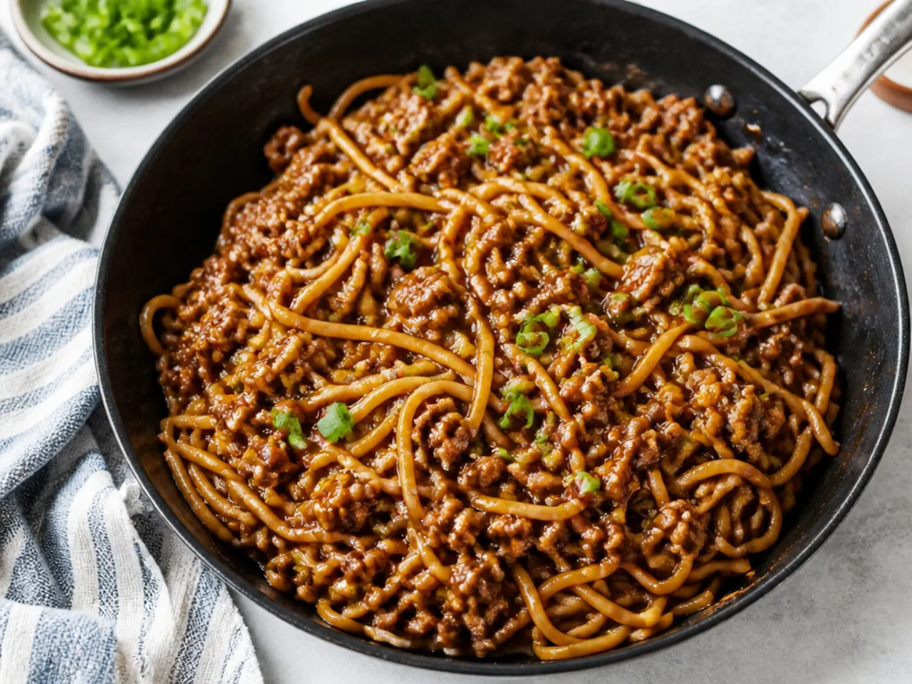 Easy ground beef Mongolian noodles in a skillet with thickened sauce