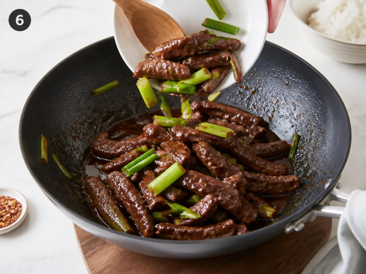 mongolian beef bowl — step 6: return the beef and spring onions