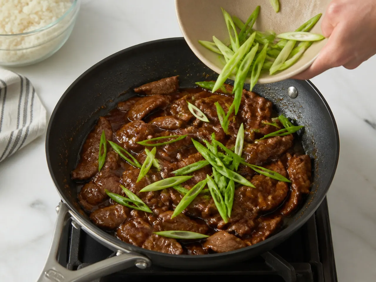 mongolian beef meal prep — step 6: return the beef and add scallions