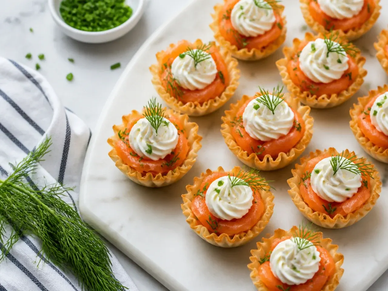 Phyllo cups topped with cream cheese, smoked salmon and fresh dill