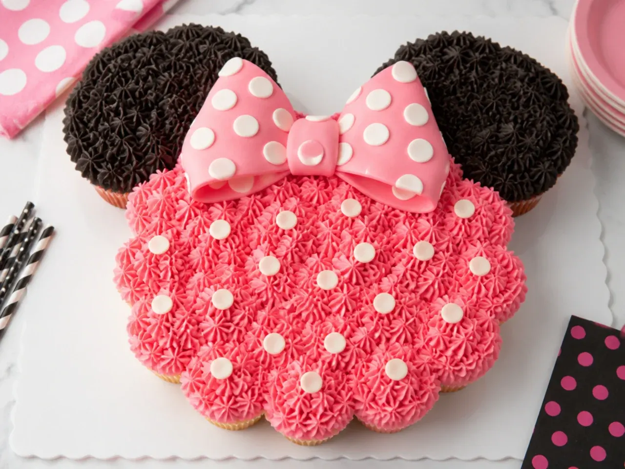 Whimsical simple Minnie Mouse pull-apart cupcake cake shaped with ears and a bow