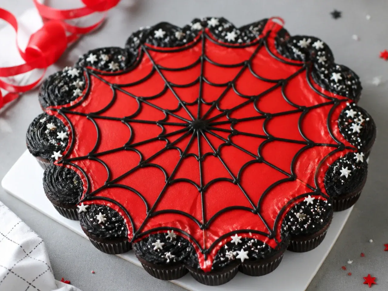 Charming Spiderman cupcake pull-apart cake for boys forming one large red and black web
