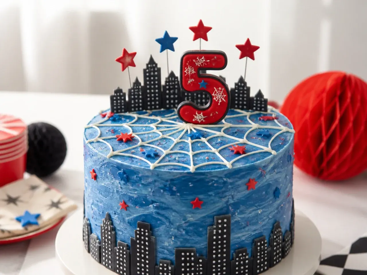 Festive spiderman cake topper with number candles set in a piped buttercream web