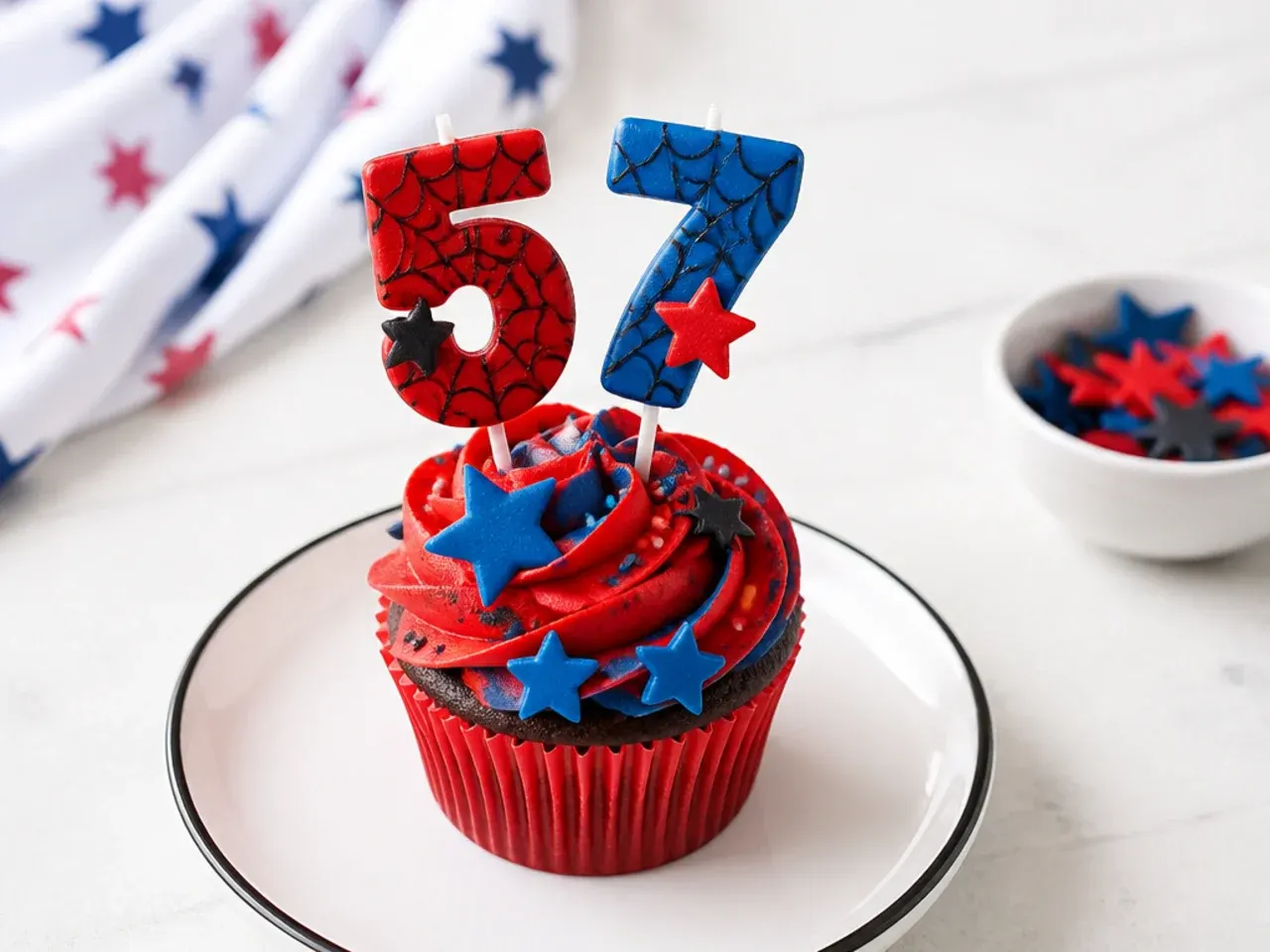 Festive Spiderman cupcakes with web-patterned birthday number toppers