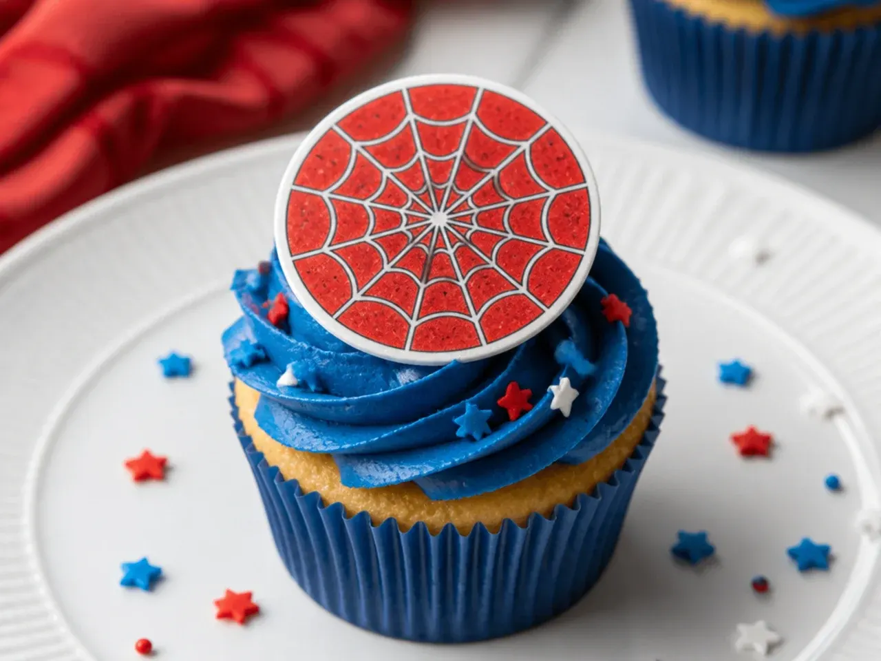 Creative Spiderman cupcakes topped with printed edible web wafer discs