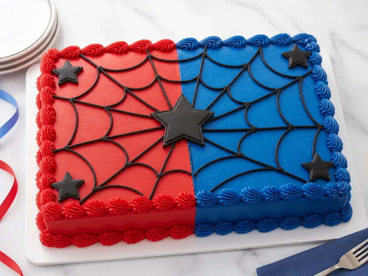Easy no-fondant Spiderman sheet cake split into red and blue buttercream halves