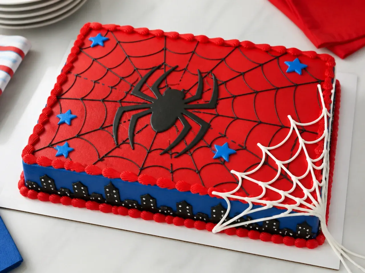 Whimsical Spiderman sheet cake with web strands slinging off one corner