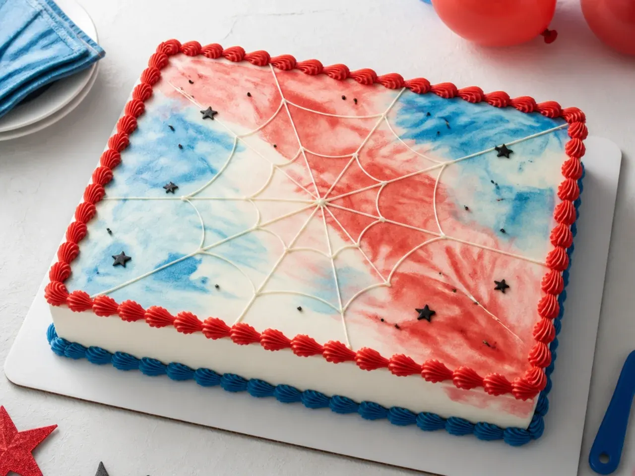 Delicate watercolor Spiderman sheet cake with soft red and blue washes and faint web