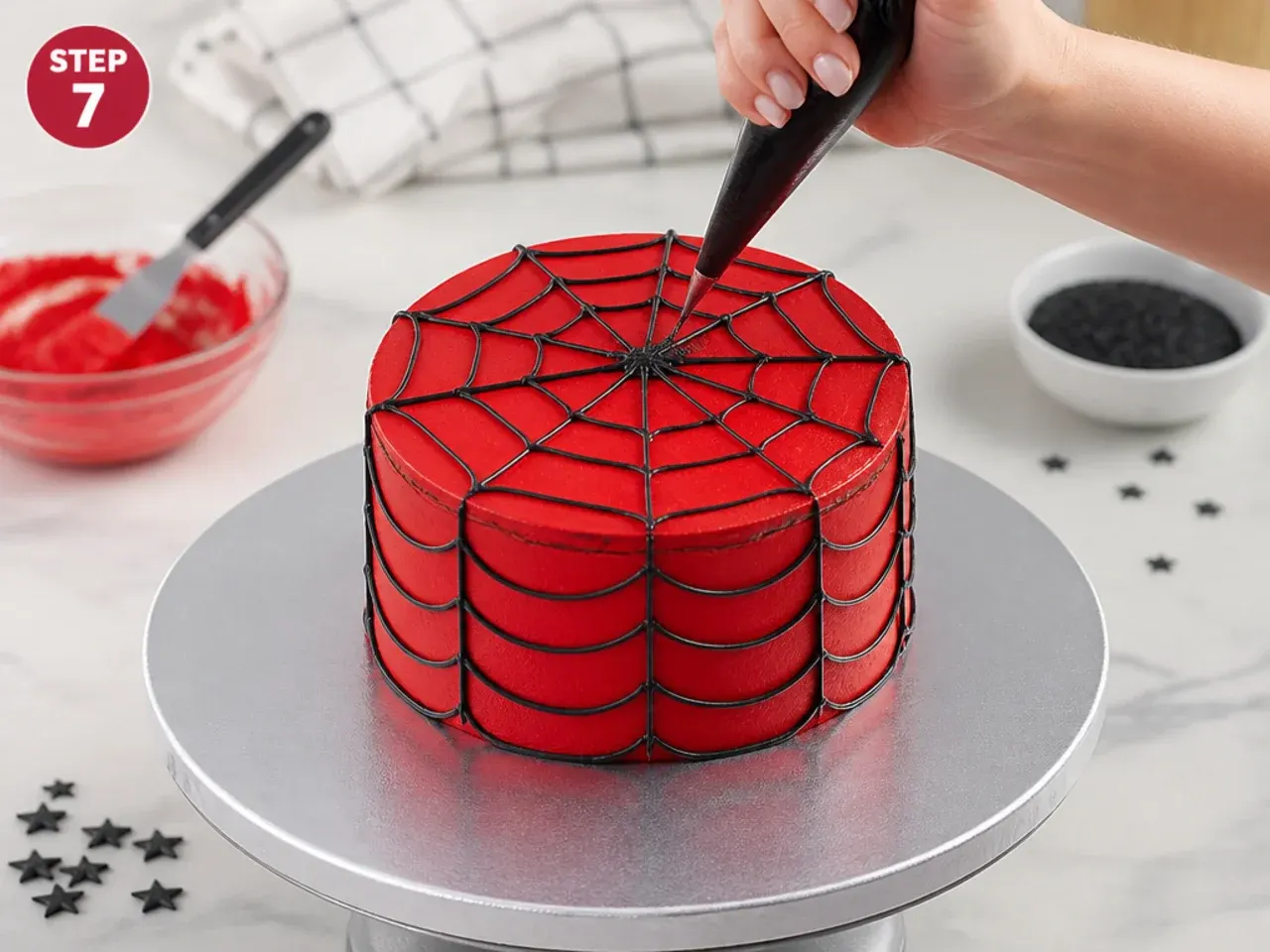 spiderman smash cake — step 7: frost and pipe the web