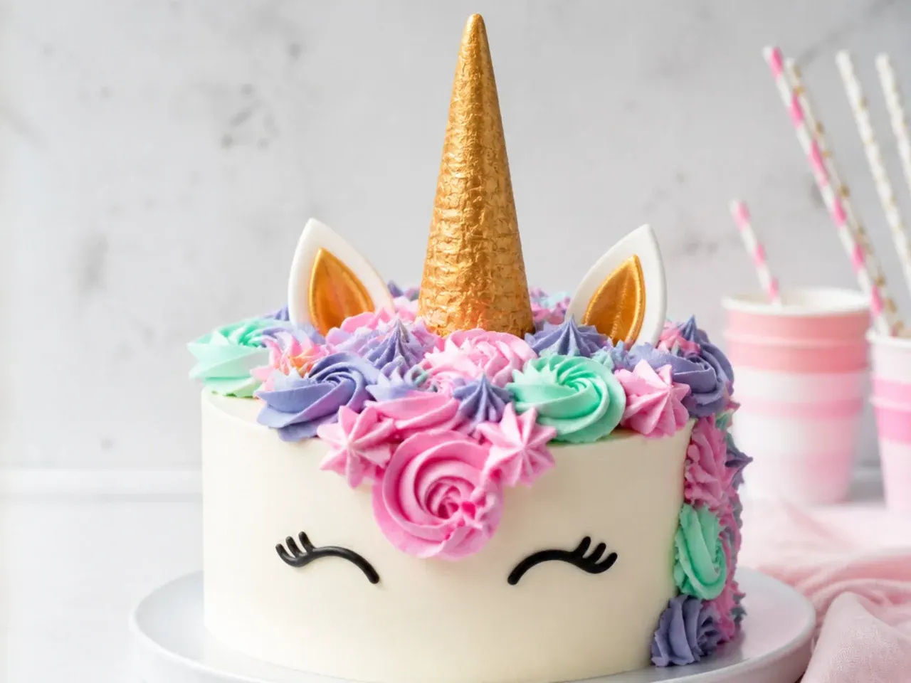 Easy no fondant unicorn cake design with gold ice cream cone horn